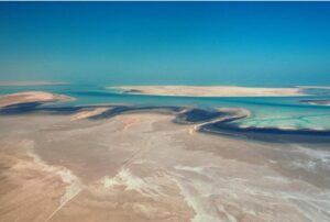 Attached is an image of a a Sabkha environment from the middle east where gypsum is deposited.